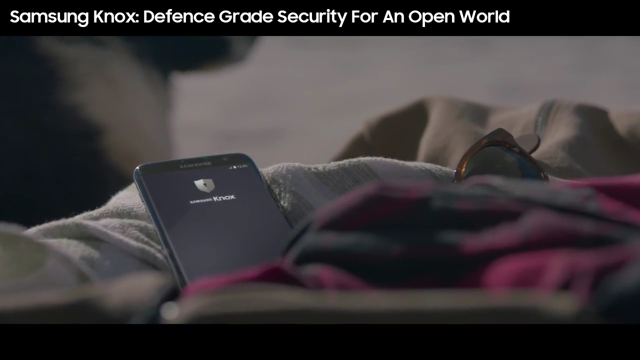 An image showing a cell phone with a Samsung KNOX GUI on. When the user clicks on it, a YouTube video entitled "Samsung Knox- Defence Grade Security For An Open World" launches.